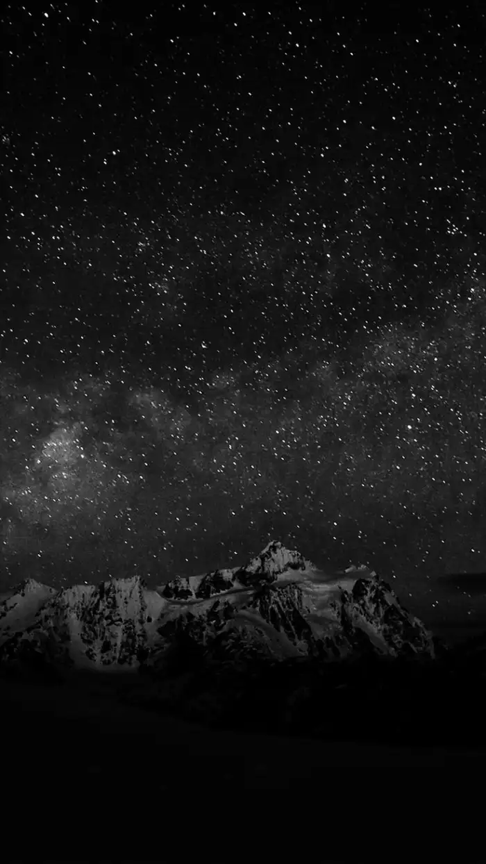 Black Mountain With A Starry Sky Above It Background