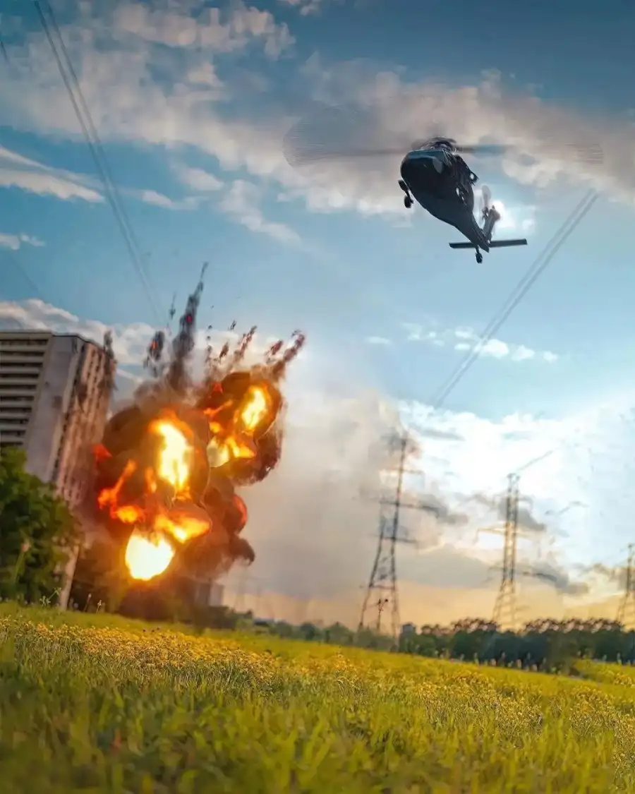 CB Helicopter Flying Over A Field Of Grass And A Fire Background