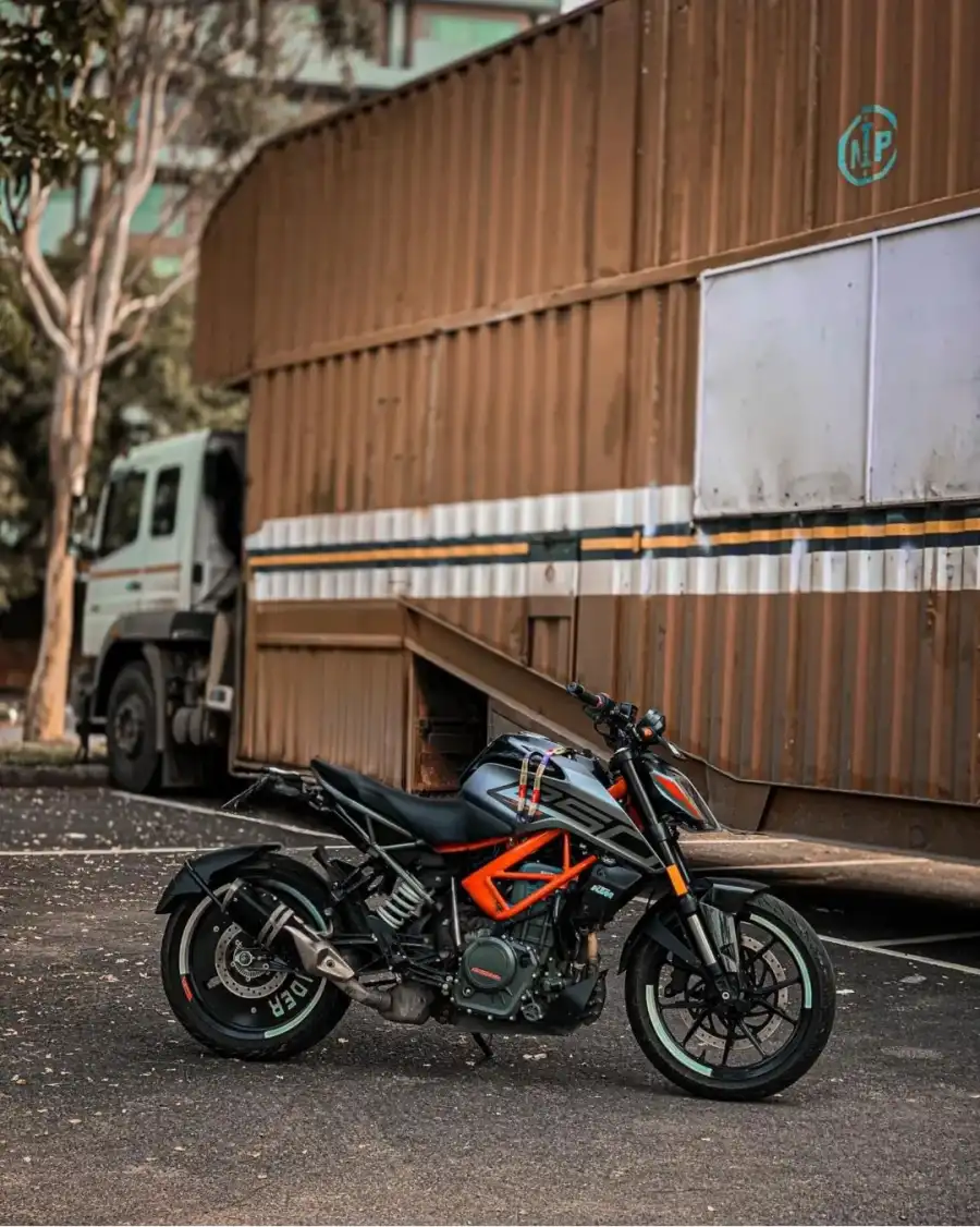 CB KTM Bike Motorcycle Parked On The Side Of A Road  Background