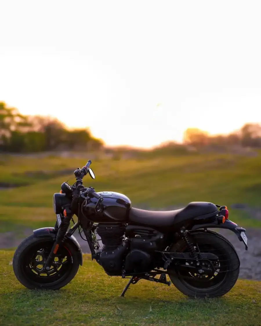 CB Motorcycle Parked On Grass Background