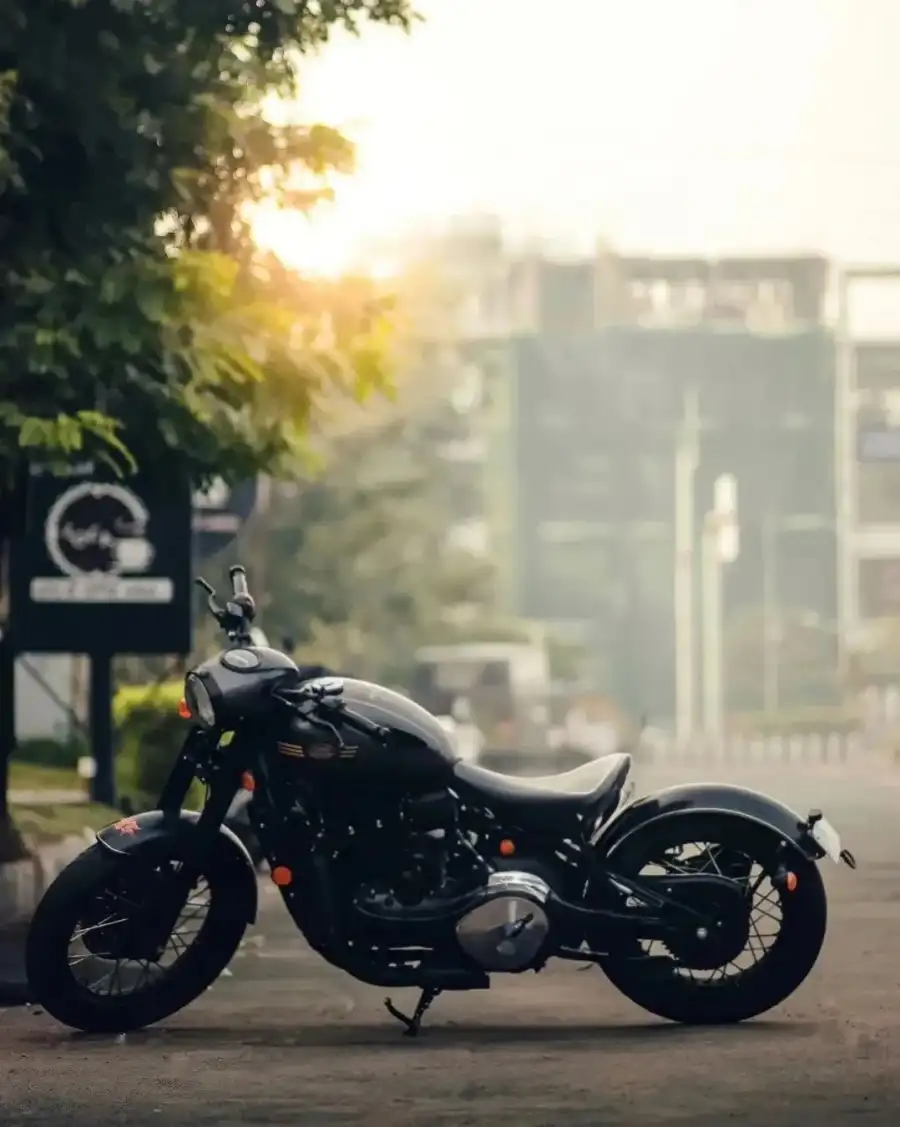 CB Motorcycle Parked On The Side Of A Road Background