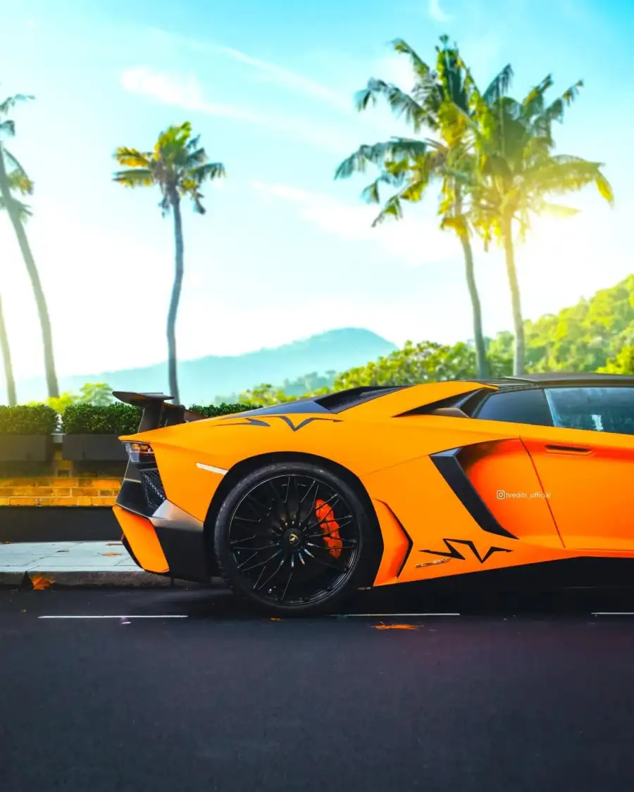 CB Orange Sports Car Parked On A Street Background