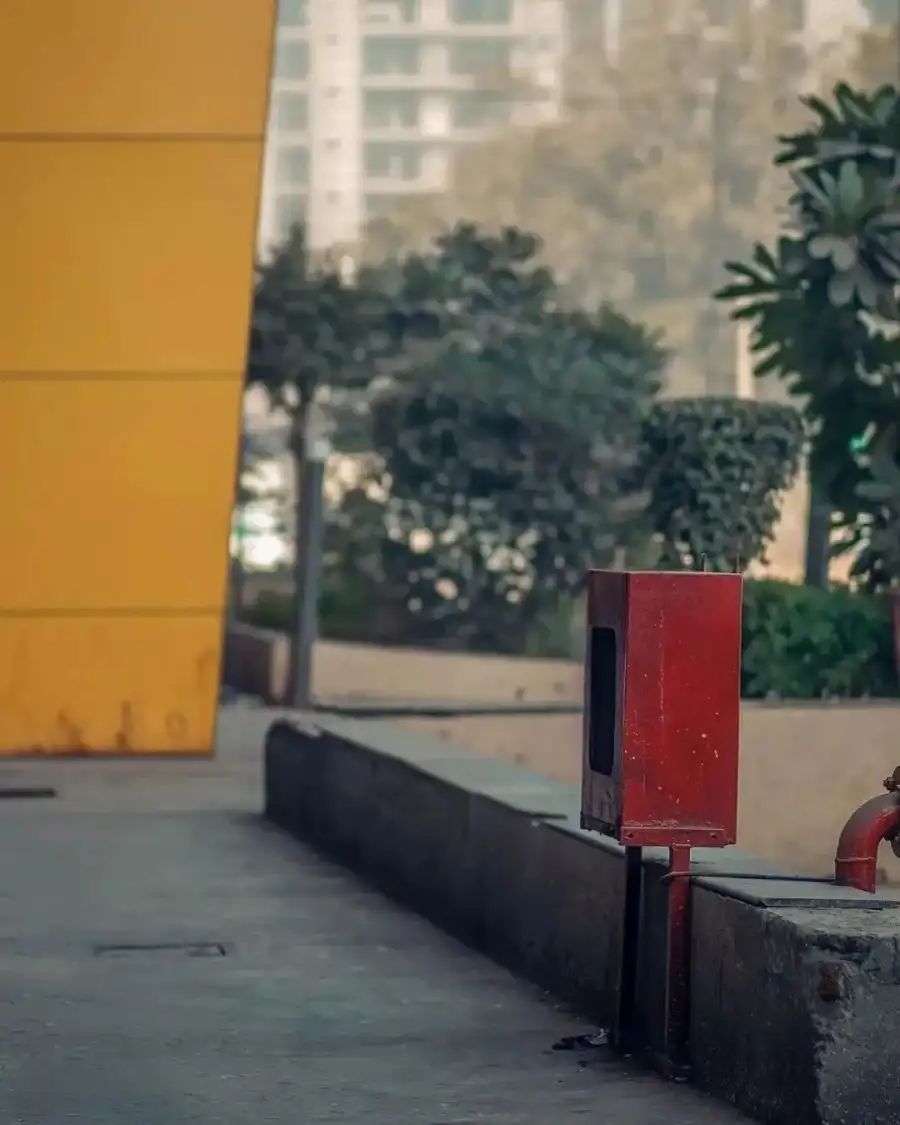 CB Red Mailbox On A Sidewalk Background