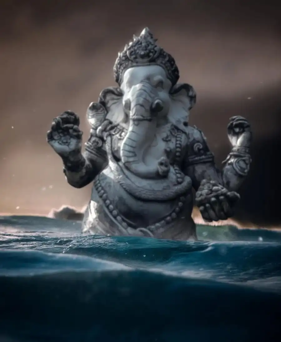 CB Statue Of A Ganpati Holding A Baby In A Body Of Water Background