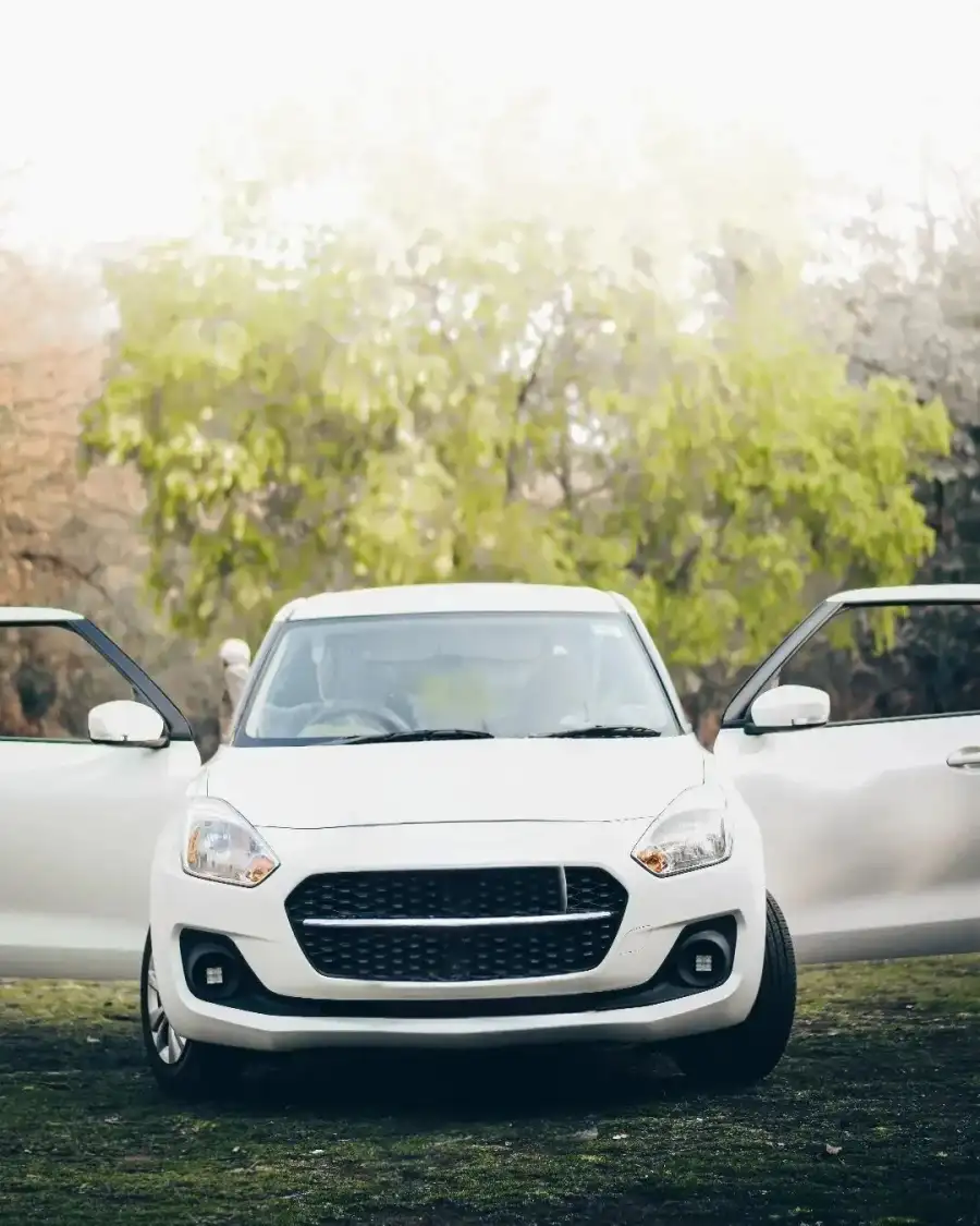 CB White Door Open Car Parked On Grass Background