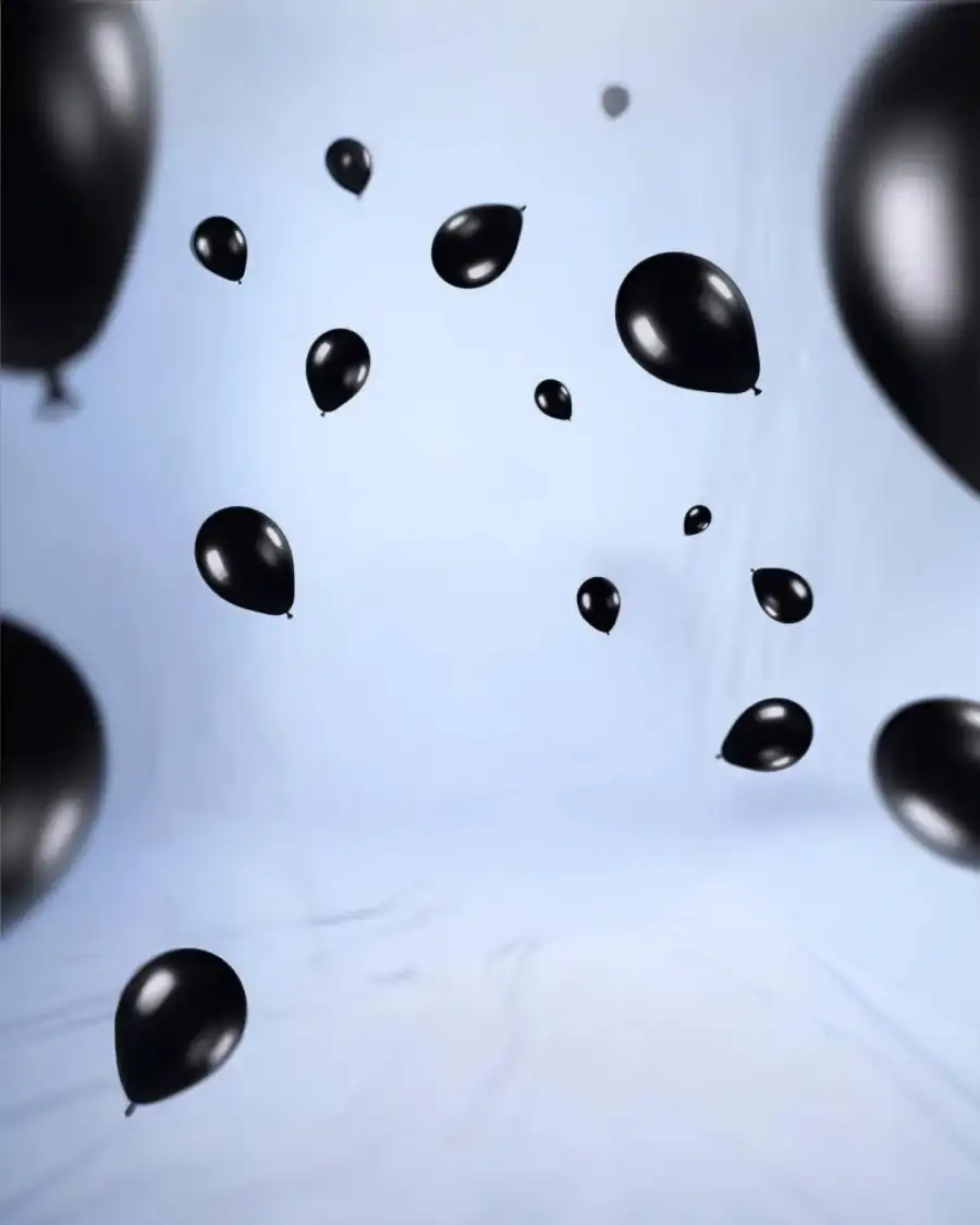 Editing A Gropu Of Black Balloons Flying Background