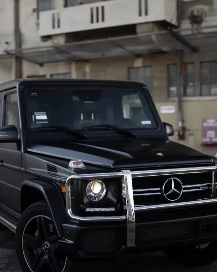 Editing Black Truck Parked In Front Of A Building Background