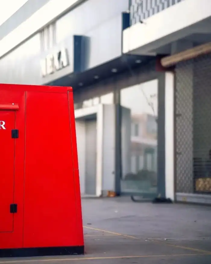 Editing Red Container Outside A Building Background