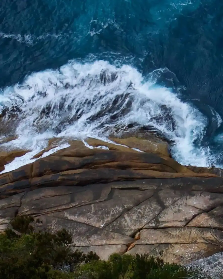 New CB Rocky Cliff With A Waterfall Background