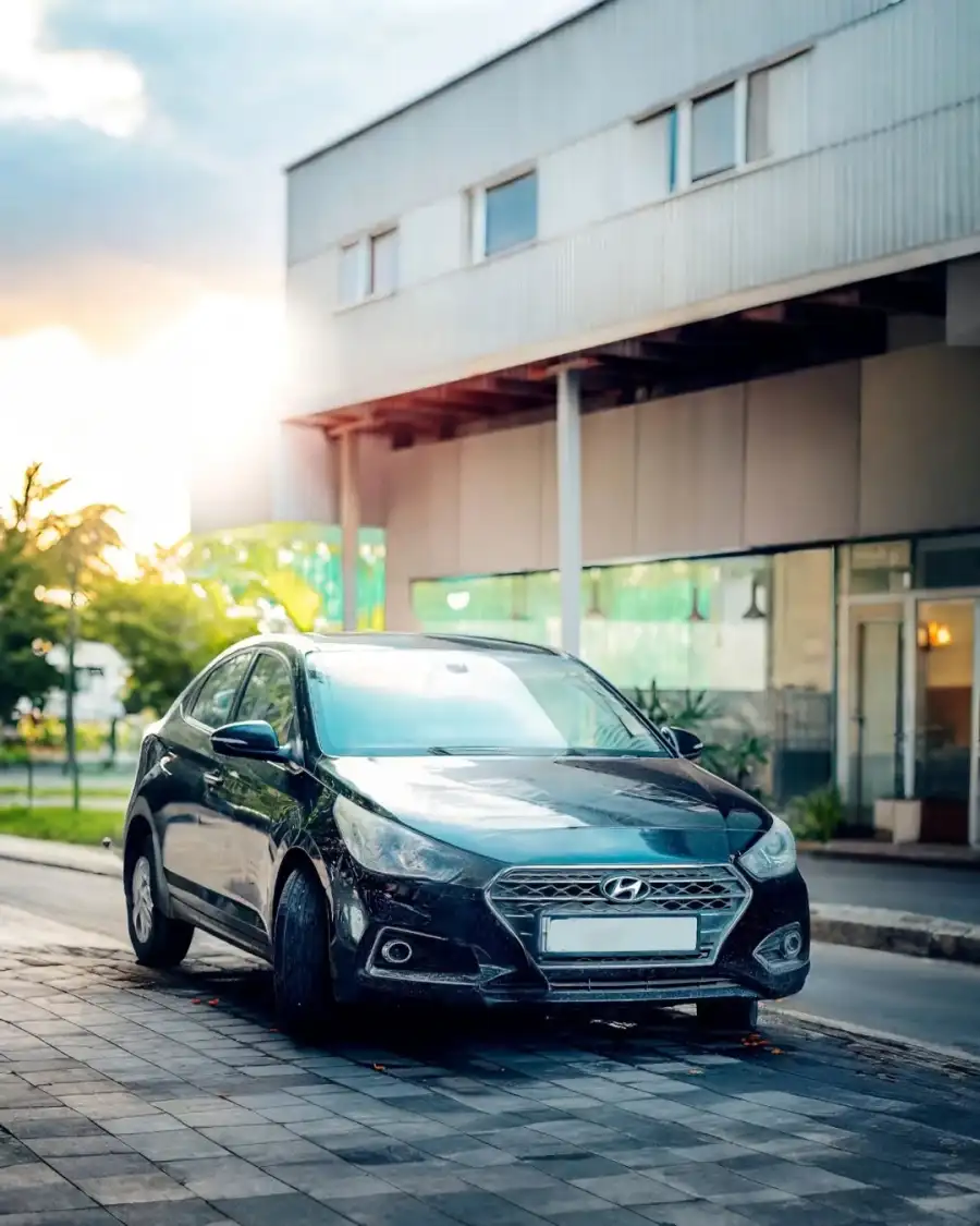 New Editing Car Parked Outside A Building Background