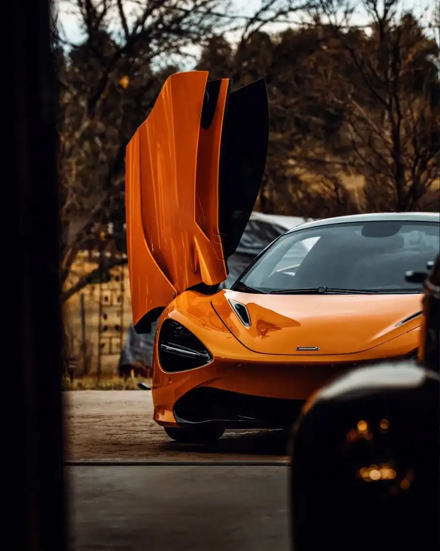 Photo Editing Orange Car With Its Hood Open Background