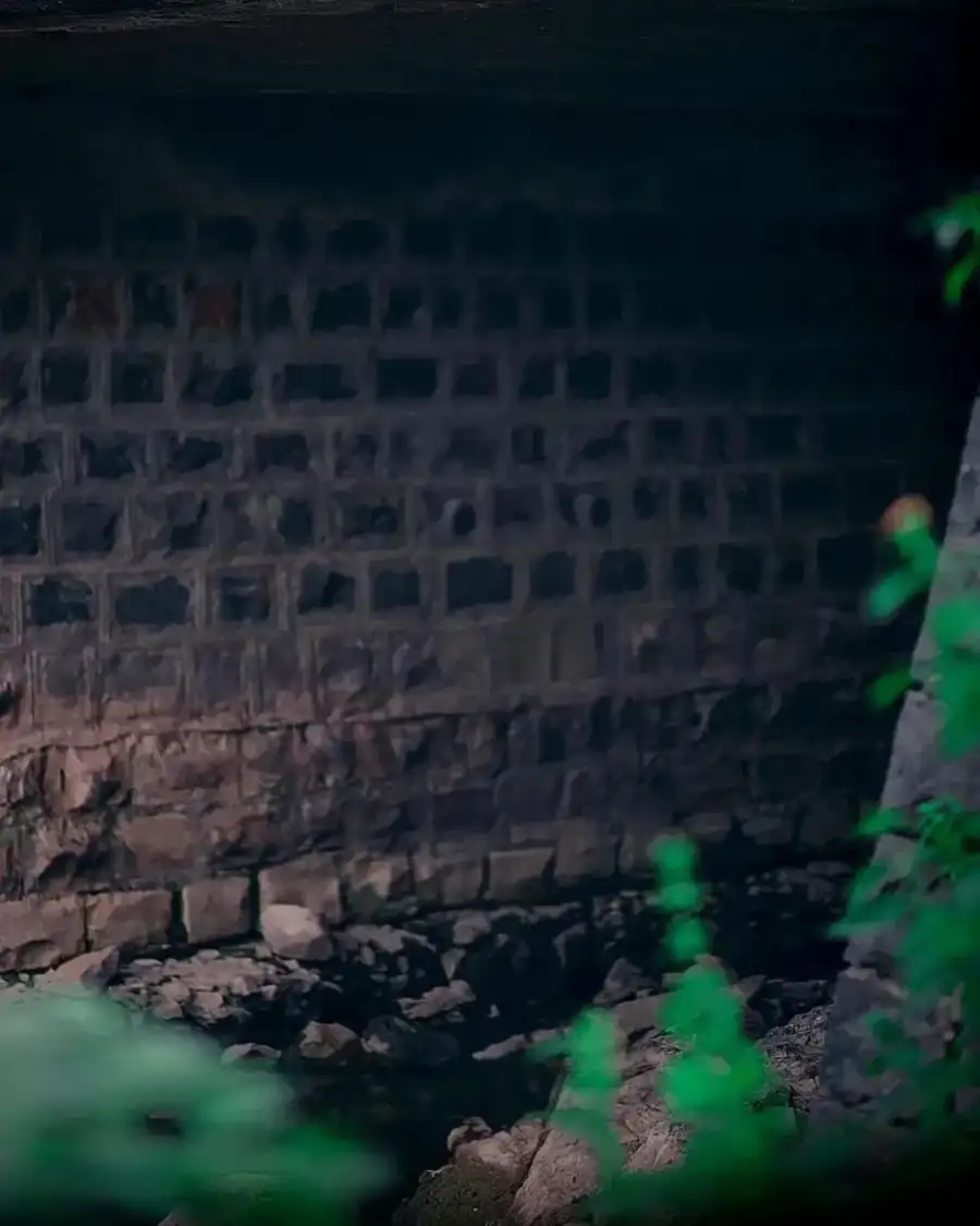 Photo Editing Stone Building With A Green Toy In Front Of It Background