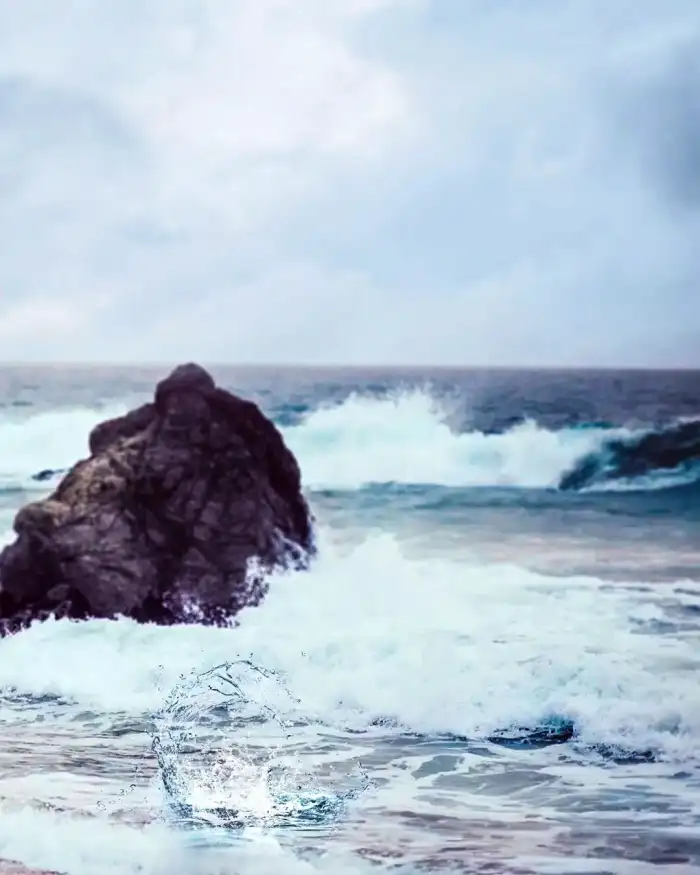 Photo Editing Water Aves Crashing Against A Rock Background