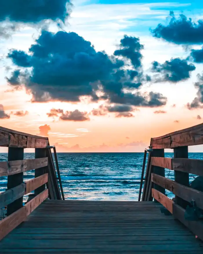 Photo Editing Wooden Dock Leading Out To The Ocean Background