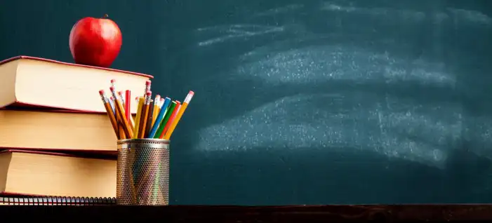 School Stack Of Books And Pencils On A Table Background