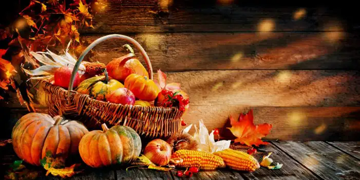 Thanksgiving Pumpkins And Berries On A Wood Surface Background