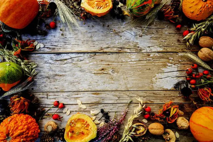 Thanksgiving Pumpkins And Berries On A Wood Surface Background