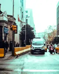 Photo Editing Truck Driving Down A Street Background